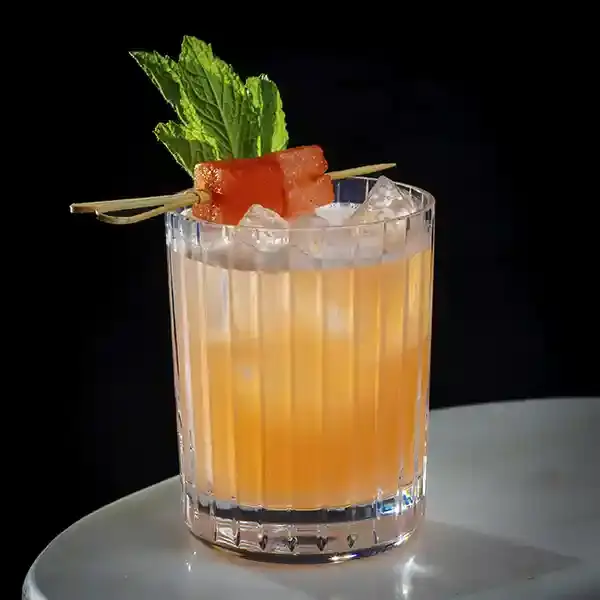 Colorful Asian-fusion cocktails lined up on a bar